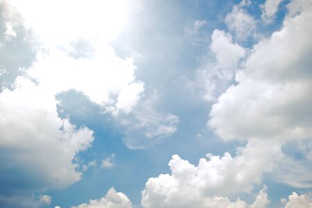 Beautiful a group of clouds in the blue sky during the sun shin background.(Processed in vintage colour tone)の写真素材