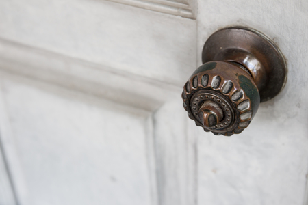Old black doorknob close up.の写真素材