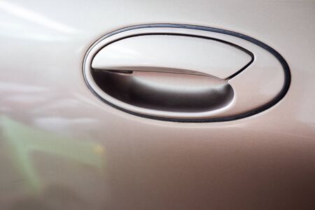 Vintage style of car door handle close up.の写真素材