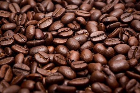 Organic coffee beans in background close up.の写真素材