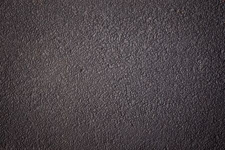 Asphalt road close up background.