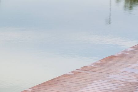 Wooden bridge over the lake.の写真素材