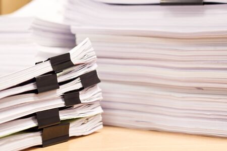 Pile of papers and document stacked on the table close up.の写真素材