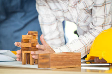 Photograph of engineer make the mock up wood brick close up.の写真素材