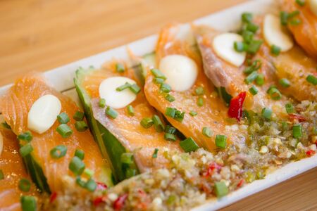 Spicy fresh sliced salmon sashimi close up.の写真素材