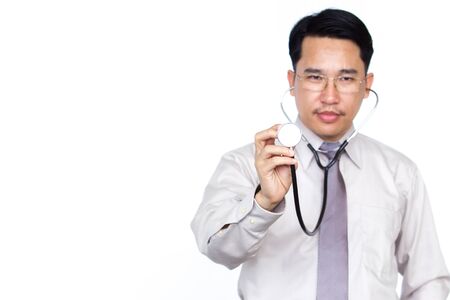 Asian doctor showing stethoscope on white background.の写真素材