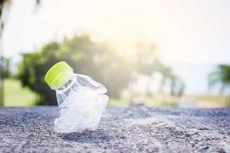 Plastic bottle was pressed use for recycle in out door park background.の写真素材