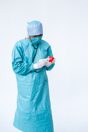 Specialist doctor checking on heart isolated on white background close up.の写真素材
