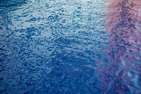 Blue water in swimming pool close up background.の写真素材