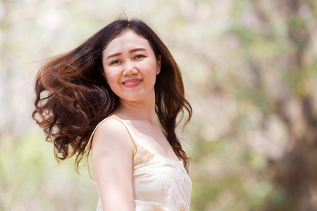 Portrait of the Asian women close up half body on nature bokeh background.の写真素材