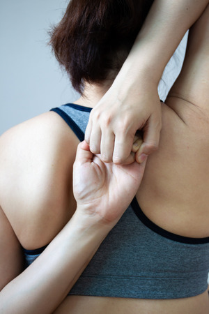 Portrait of Asian women age between 25-30 years old doing a stretching before exercise close up haft body.の写真素材