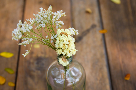 Small bouquet of flower decorated on a wooden table close up for the valentine festival.の写真素材