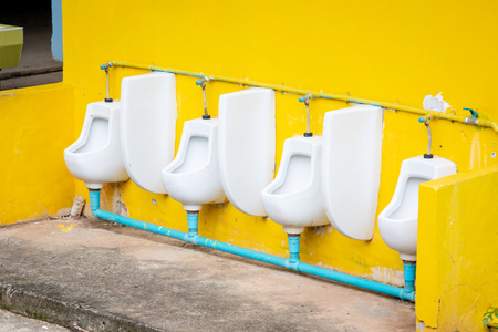 Dirty public male toilet.の写真素材