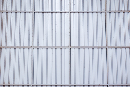 Warehouse wall build from metal sheet structure close up for background.の写真素材