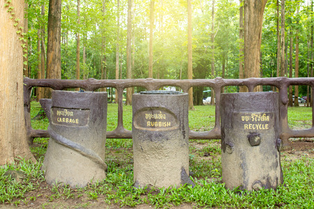 Separate type bins in the park.  Conceptual of environment conservation.