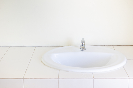 White ceramic washbasin installed in the kitchen room.の写真素材
