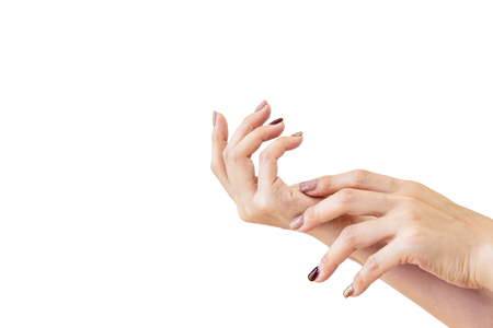 Young Asian women hands with painted nails close up.  Isolated on white background.の写真素材