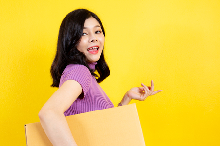 Asian girl's portrait in e-commerce and parcel service concept.の写真素材