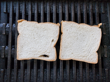 Grilling a white breads on a stove close up.の写真素材