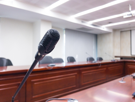 Conference microphones on the table in the conference room.の写真素材