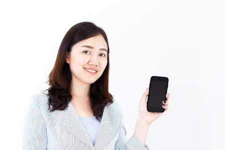 Asian business women showing a smartphones on white background.の写真素材