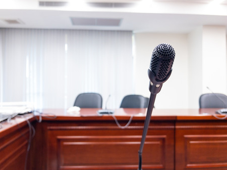 Conference microphones on the table in the conference room.の写真素材