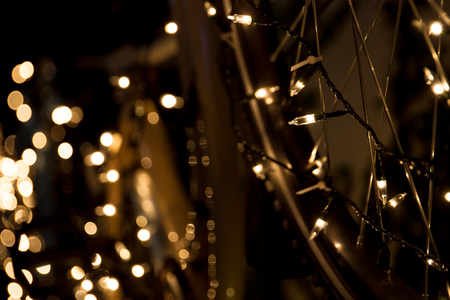 Light bulb bokeh in the dark close up background.の写真素材