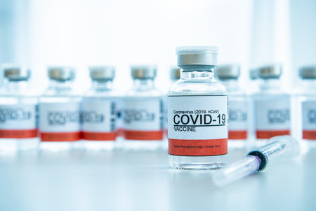 Coronavirus - 2019-nCoV or COVID-19 vaccine bottles for injection use only. Urgent vaccine research and production use in COVID-19 - Coronavirus disease. COVID-19 vaccine close up with copyspace.の写真素材