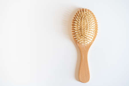Used dirty hair brush left on the table with copyspace, hair fall problem concept.の写真素材