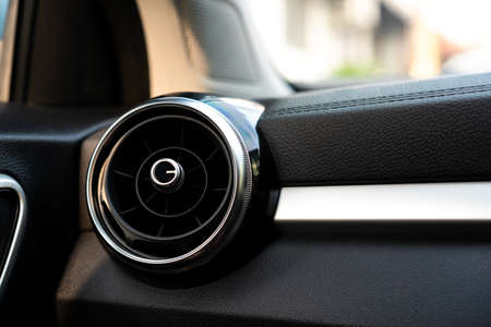 Close up shoot of air conditioner grille in the modern vehicle with copyspace. Ventilator system in the modern car closeup.の写真素材