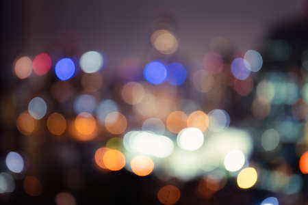 Beautiful lighting bokeh of city at night, defocused blur background of night city.の写真素材
