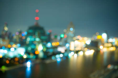 Beautiful lighting bokeh of city at night, defocused blur background of night city.の写真素材