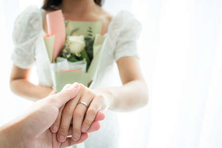 Happy Asian young couple in Valentine or anniversary stay together, man giving and surprise his wife...