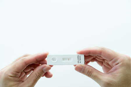 2019 SARS-nCoV coronavirus or COVID-19 antigen test kit shown a positive result. COVID-19 ag test kit for self testing at home. COVID19 ag rapid test kit.の写真素材