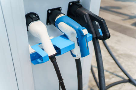 Photograph of the modern electric vehicle charging station or EV quick charging station for battery electric vehicle and plug-in hybrid electric vehicle.の写真素材