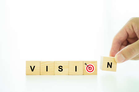 Word vision and mission on a wooden blocks, business strategic planning concept.の写真素材