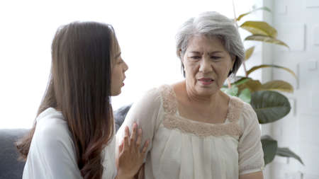 Happy Asian family concept, daughter embracing and taking care her mother. Wellness - mental health in senior or elder people.の写真素材