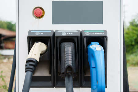 Photograph of the modern electric vehicle charging station or EV quick charging station for battery electric vehicle and plug-in hybrid electric vehicle.の写真素材