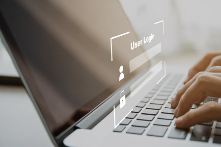 Unrecognizable woman trying to login into laptop or notebook computer with secured login and password interface. Using cybersecurity and confidential login to verify personal information.の写真素材