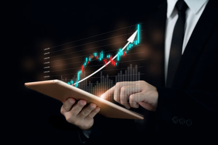 Unrecognizable businessman holding a digital tablet and showing a business chart or bar graph with a year 2023 in hologram with copy space. A successful and growth in business in 2023 concept.の写真素材