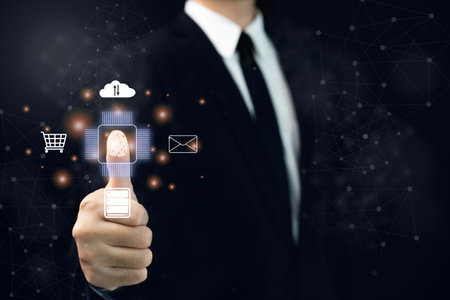 Unrecognizable businessman using a thumb finger print to unlock or access to the secured computer system. Data and network security system concept.の写真素材