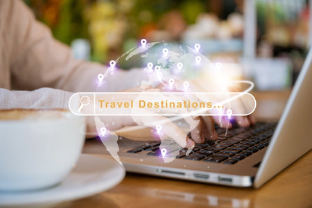 Unrecognizable Asian woman using laptop to searching for a vacation - holiday traveling trip and destinations with the search engine text box and global map in illustration.の写真素材