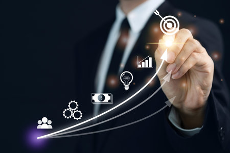 Concept of business and financial growth. Unrecognizable businessman in business smart casual pointing a stylus on the graphic chart in business growth concept.の写真素材