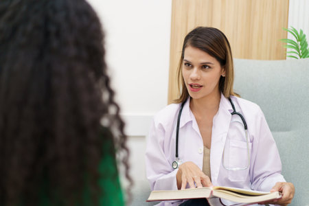 Female specialist or professional doctor giving a consulting to female patient in clinic.の写真素材