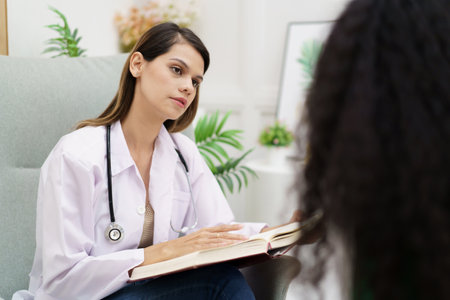 Female specialist or professional doctor giving a consulting to female patient in clinic.の写真素材