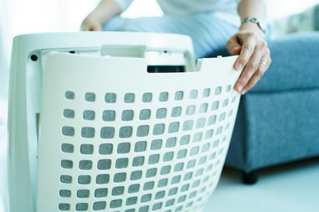Asian woman changing the dirty air purifier filter after using for a long time in the dirty air...