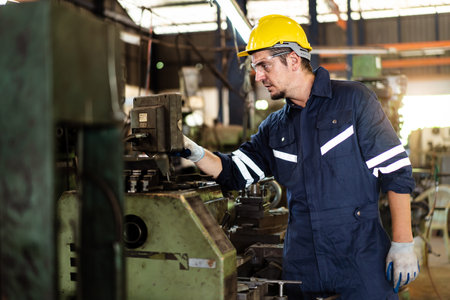 Professional caucasian white ethnicity male technician operating the heavy duty machine in the...