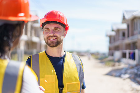 Construction foreman and client making a handshake together after completed the new contract.の写真素材