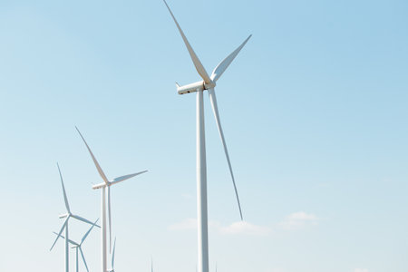 Landscape photography of the electric generator windmills in rural area. Sustainable and clean energy concept.の写真素材