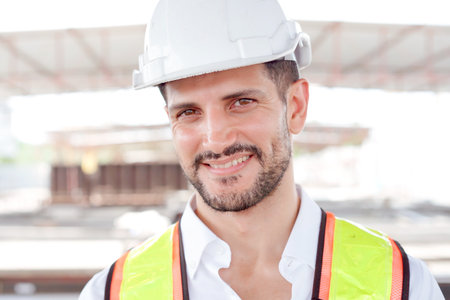 Senior Asian civil engineer performs the inspection at construction site, male engineer analyzing...
